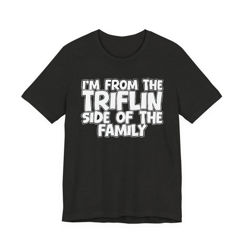 Black Heather t-shirt with "I'M FROM THE FAKE SIDE OF THE FAMILY" in bold white outlined bubble lettering, front flat-lay view