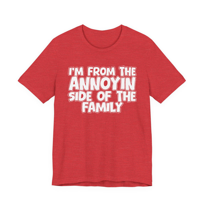 light t-shirt with ‘I’M FROM THE ANNOYIN SIDE OF THE FAMILY’ statement text in bold outline lettering, front flat-lay view.