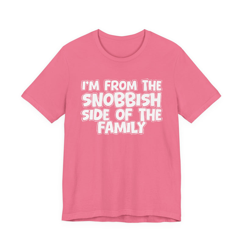 Charity Pink t-shirt with white outlined bubble lettering reading 'I'M FROM THE SNOBBISH SIDE OF THE FAMILY', front flat-lay view.