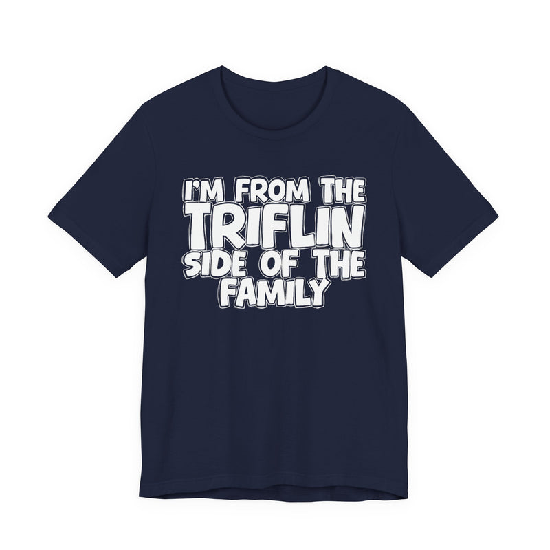 Navy t-shirt with "I'M FROM THE FAKE SIDE OF THE FAMILY" in bold white outlined bubble lettering, front flat-lay view