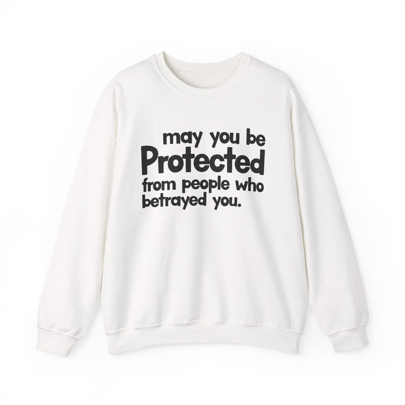 May You Be Protected From People Who Betrayed You — Sweatshirt fabric detail close-up: MAY YOU BE PROTECTED FROM PEOPLE WHO BETRAYED YOU in bold statement lettering. Street Talk Designs protection statement apparel.