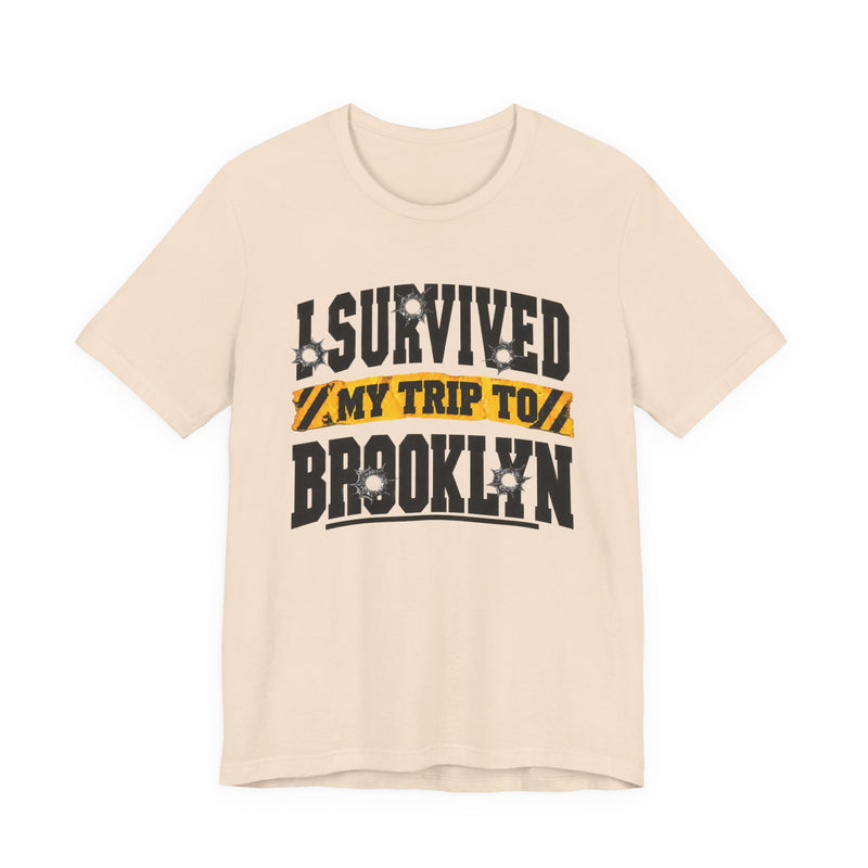 T-Shirt with collegiate lettering reading I SURVIVED MY TRIP TO BROOKLYN, front view.