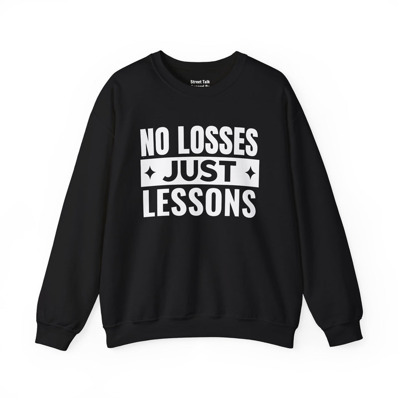Black sweatshirt with white block lettering reading NO LOSSES JUST LESSONS, front view.