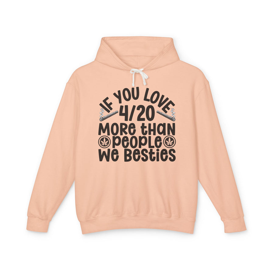 If You Love 4/20 More Than People We Besties — Hoodie front view: IF YOU LOVE 4/20 MORE THAN PEOPLE WE BESTIES in dark brown rounded lettering with joint graphics — dark brown rounded lettering with joint graphics on peach. Street Talk Designs 420-friendly statement apparel.
