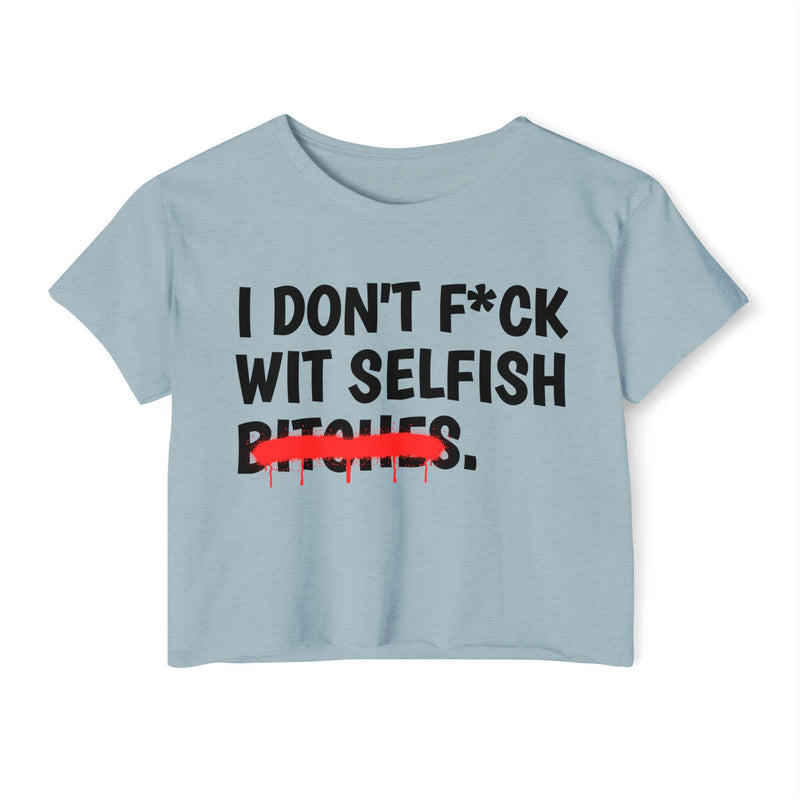 Smoked Paprika crop top with the I DON'T F*CK / WIT SELFISH / BITCHES. statement print in black letters and a red spray-paint strike-through across BITCHES., front view.