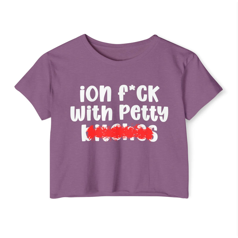Purple crop top with white "ion f*CK With Petty bitches" statement graphic with a red marker strike-through crossing out the bottom word, front flat-lay on white background.