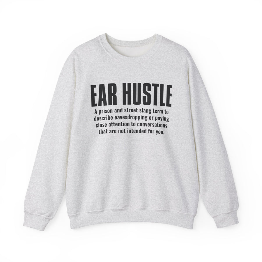 Ash sweatshirt with black block lettering reading EAR HUSTLE, definition text print, front view.