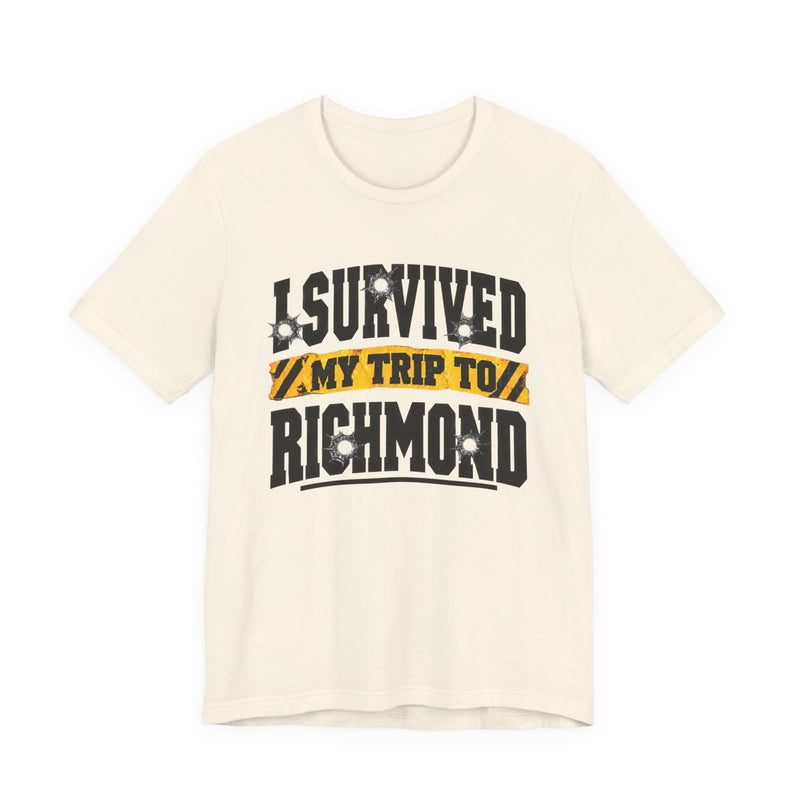 T-Shirt product photo with arched collegiate lettering reading "I SURVIVED" with bullet-hole decals, a caution-tape band reading "MY TRIP TO", and large block letters reading "RICHMOND", front view.