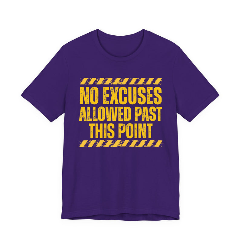 Navy tee with yellow distressed yellow block lettering reading "NO EXCUSES ALLOWED PAST THIS POINT", front flat-lay view, with caution-stripe bars.