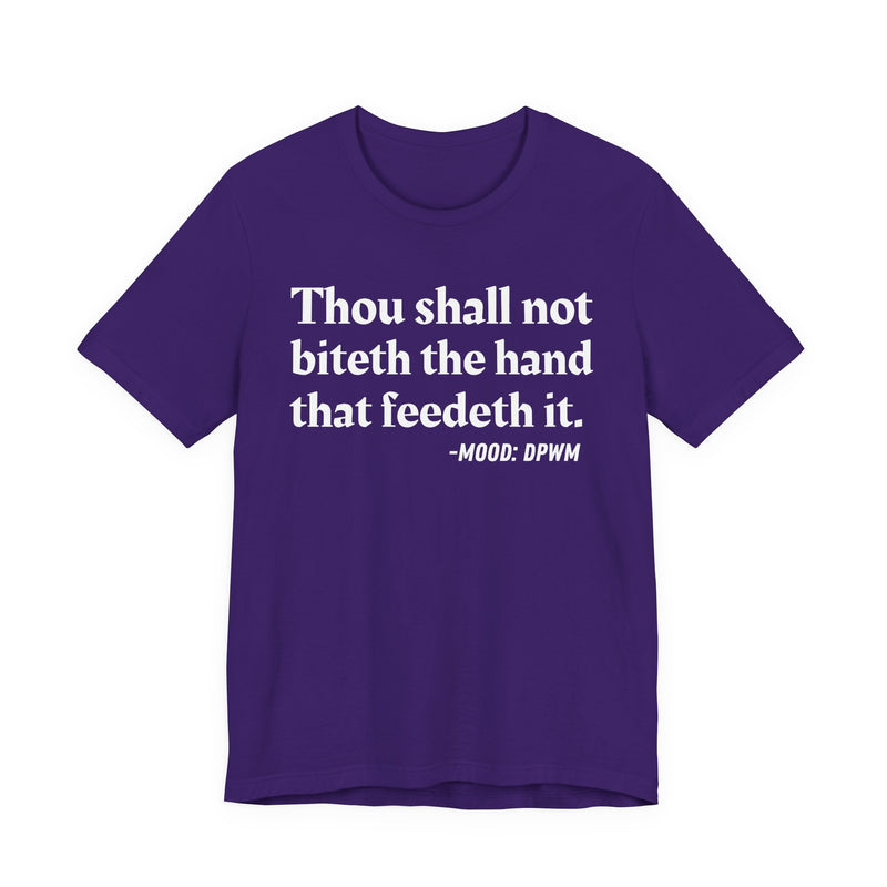 T-Shirt with text design reading “THOU SHALL NOT BITETH THE HAND THAT FEEDETH IT”, front view