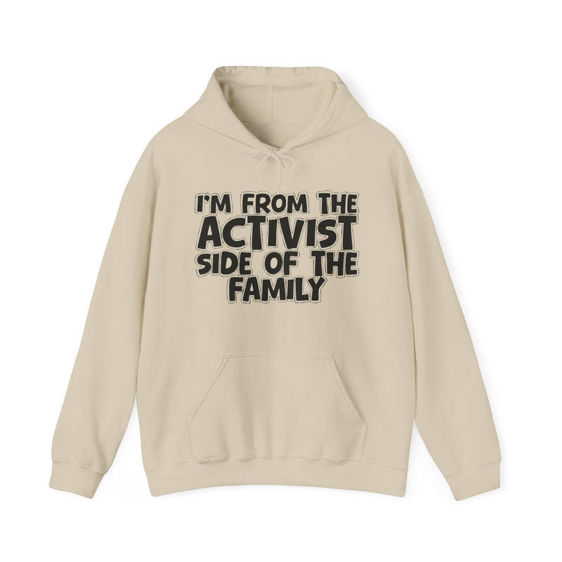 Sand hoodie with "I'M FROM THE ACTIVIST SIDE OF THE FAMILY" in bold black outlined bubble lettering, front flat-lay view