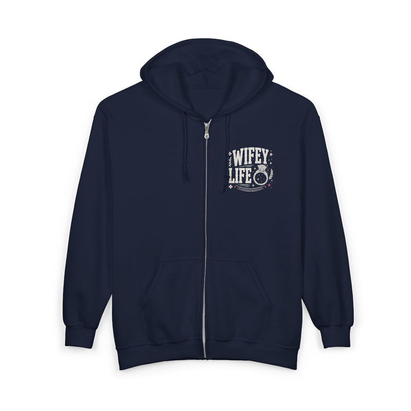 Navy zip hoodie with white and pink chest lettering reading "WIFEY LIFE", front flat-lay view.