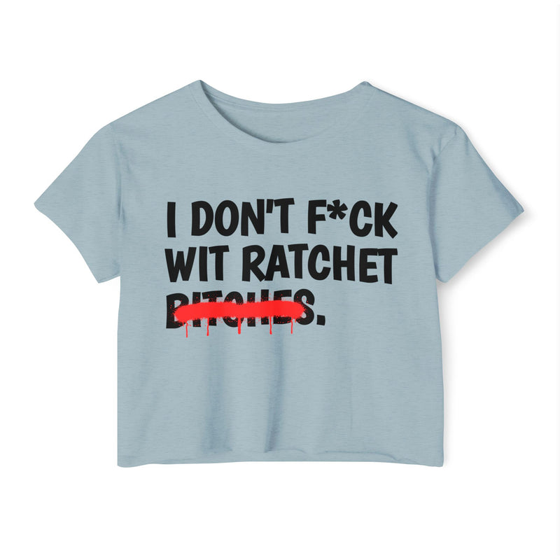Sky Blue crop top with black bold lettering reading I DON'T F*CK WIT RATCHET BITCHES, crossed by a red dripping strikethrough, front flat-lay view.