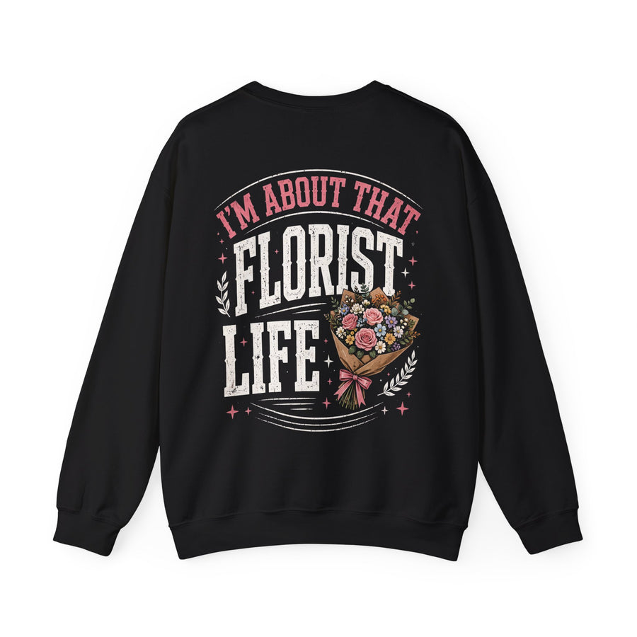Black sweatshirt with white and pink lettering reading "I'M ABOUT THAT FLORIST LIFE", back view.