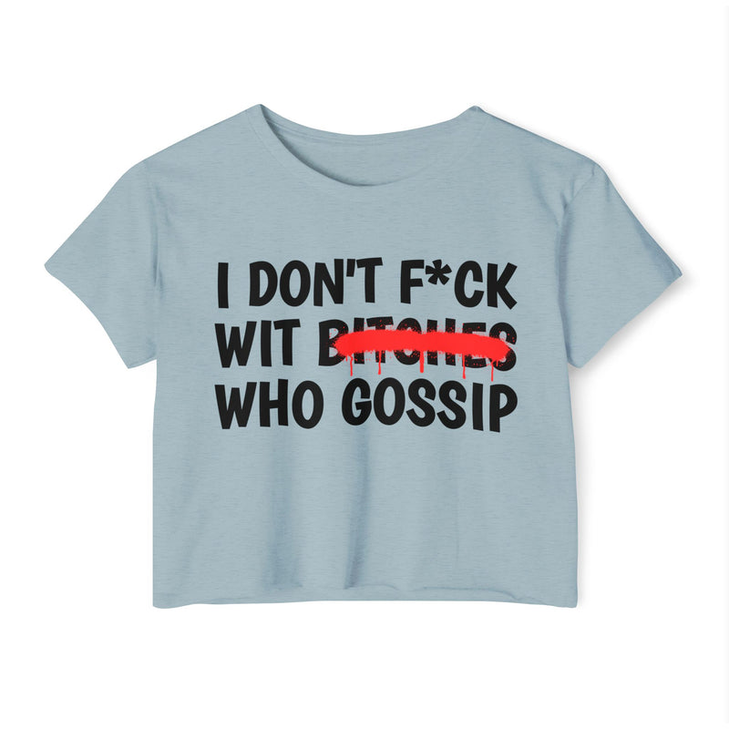 light blue crop top, front flat-lay view with black text print reading I DON'T F*CK WIT BITCHES WHO GOSSIP (F*CK censored with an asterisk; red strikethrough through BITCHES)