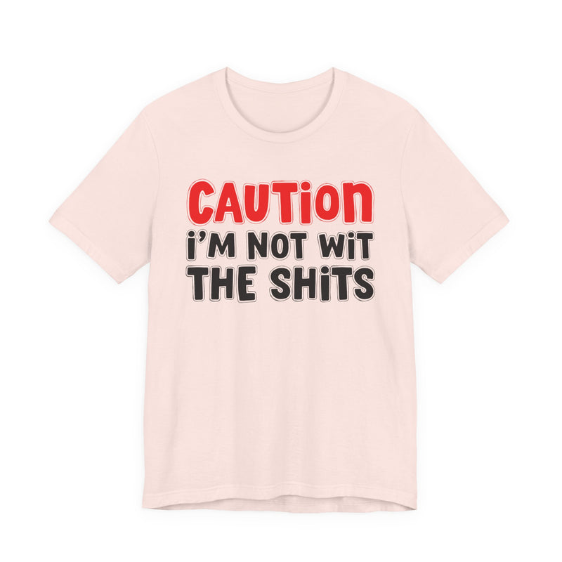 T-Shirt in Soft Pink with lettering reading "CAUTION: I'M NOT WIT THE SHITS", front view.