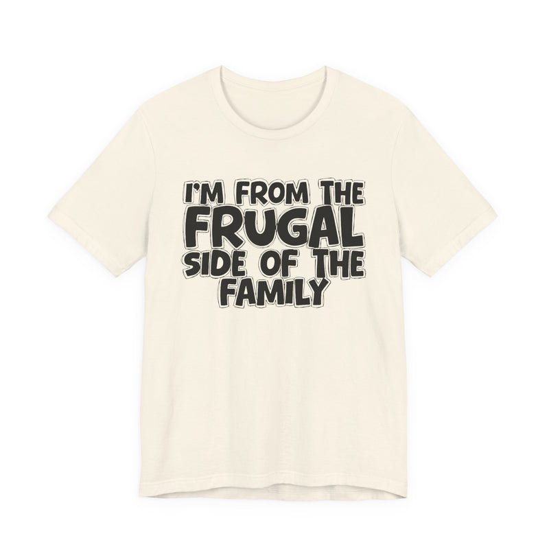 Soft Cream t-shirt with 'I'M FROM THE FRUGAL SIDE OF THE FAMILY' in black hand-drawn bubble lettering on the chest, front flat-lay mockup view.