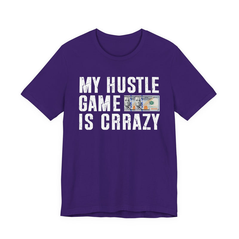 White t-shirt with dark bold grind lettering reading MY HUSTLE GAME IS CRAZY, front flat-lay view.