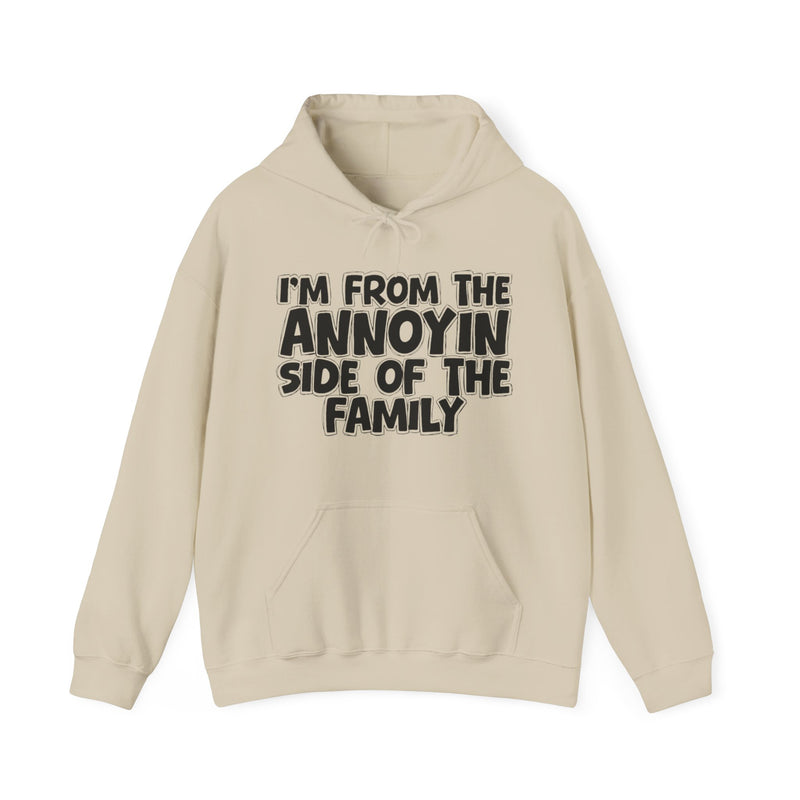 light hoodie with ‘I’M FROM THE ANNOYIN SIDE OF THE FAMILY’ statement text in bold outline lettering, front flat-lay view.