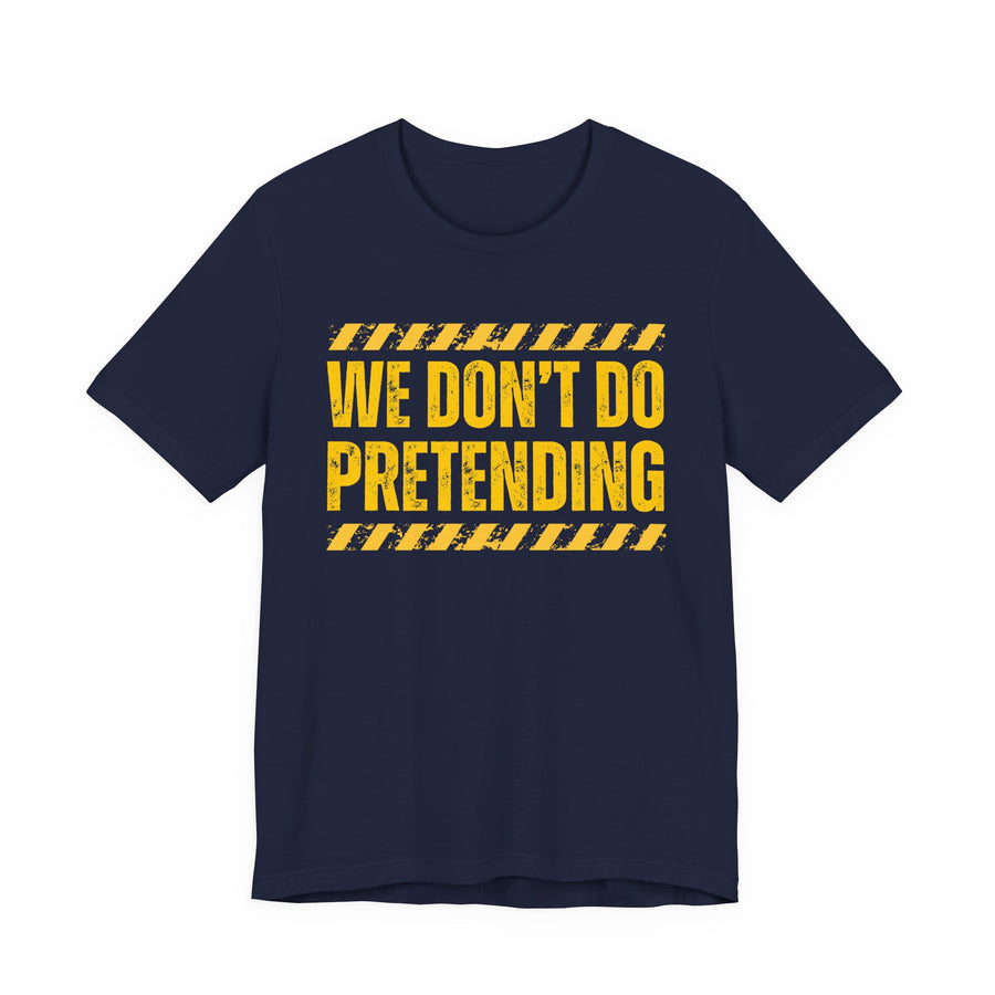 Navy t-shirt with yellow bubble lettering reading WE DON'T DO PRETENDING, front.