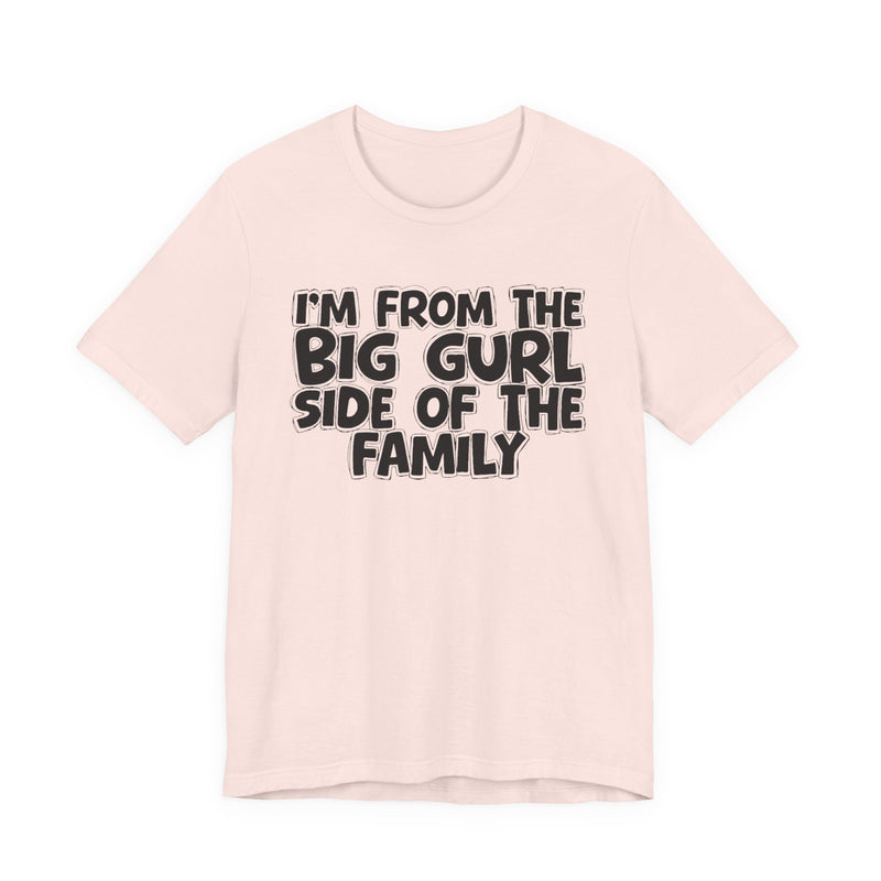 Black t-shirt with bold chest statement text reading 'I'M FROM THE BIG GURL SIDE OF THE FAMILY,' front flat-lay view.