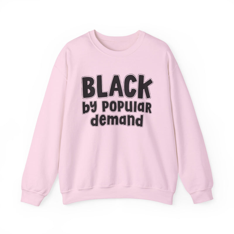 Light Pink sweatshirt with ‘BLACK by popular demand’ in bold block and script lettering graphic in dark-contrast print, front flat-lay mockup view
