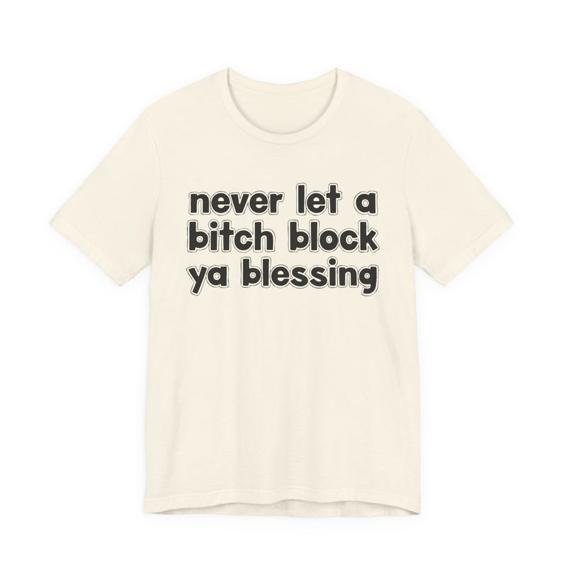 Ash t-shirt with white lettering reading "never let a bitch block ya blessing", front flat-lay view.