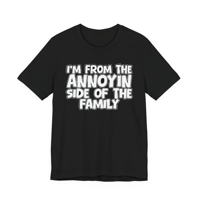 dark t-shirt with ‘I’M FROM THE ANNOYIN SIDE OF THE FAMILY’ statement text in bold outline lettering, front flat-lay view.