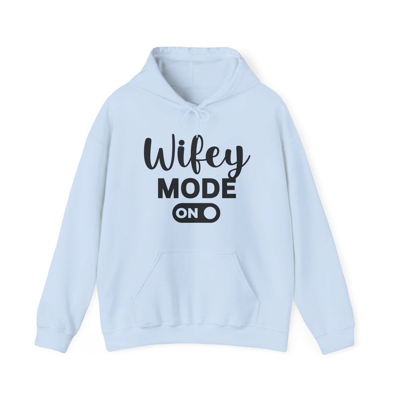 Ash hoodie with black bold block lettering reading WIFEY MODE ON, front flat-lay view.