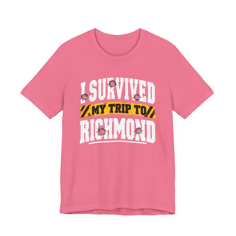 T-Shirt product photo with arched collegiate lettering reading "I SURVIVED" with bullet-hole decals, a caution-tape band reading "MY TRIP TO", and large block letters reading "RICHMOND", front view.