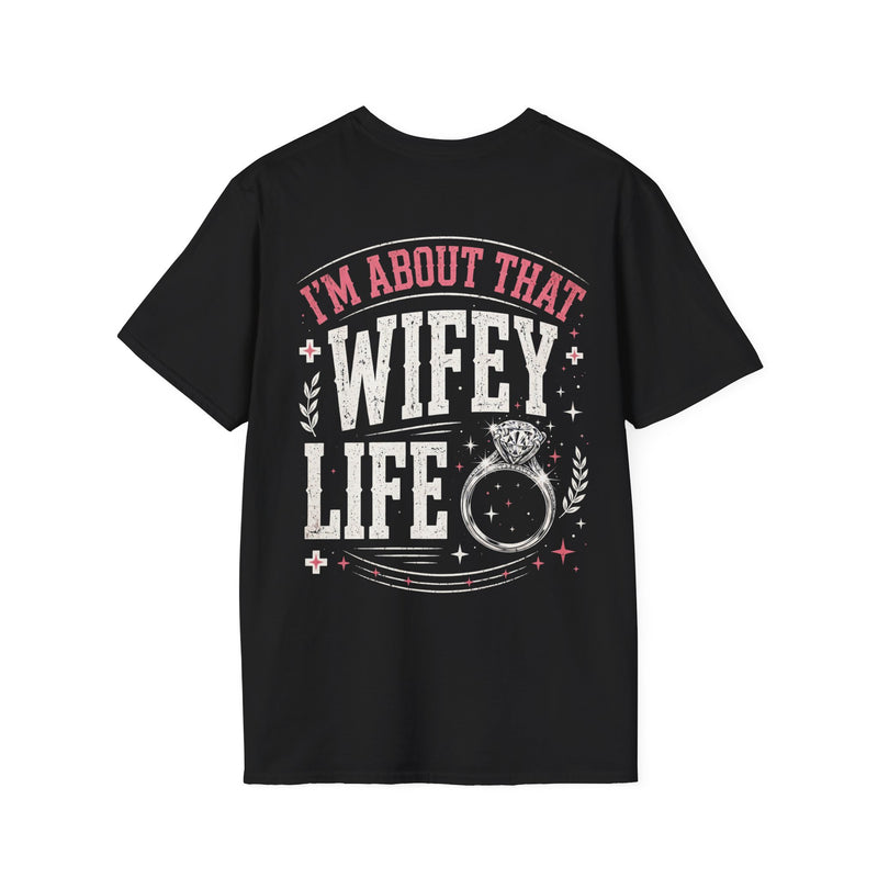 Black t-shirt with white bold block lettering reading I'M ABOUT THAT WIFEY LIFE, front flat-lay view.