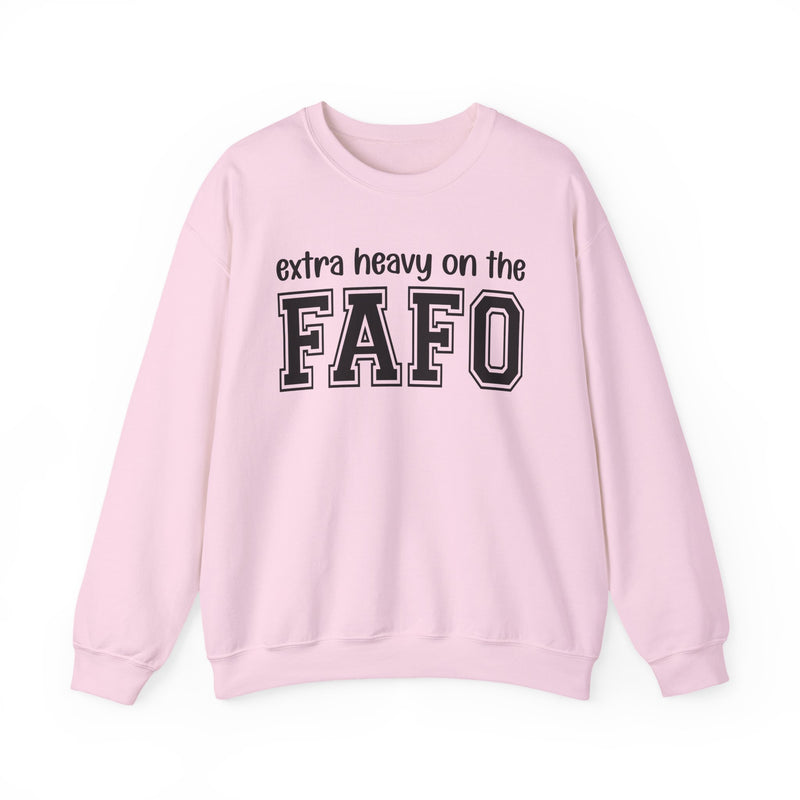 Sweatshirt in Light Pink with lettering reading "EXTRA HEAVY ON THE FAFO", front view.