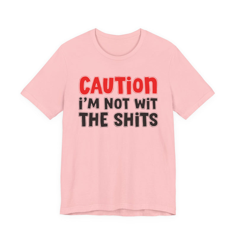 T-Shirt in Pink with lettering reading "CAUTION: I'M NOT WIT THE SHITS", front view.