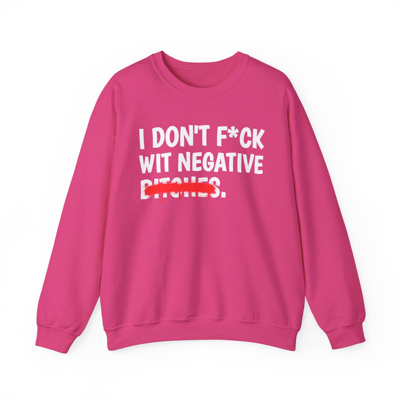 Hot pink sweatshirt with hot pink bold boundary lettering reading I DON'T FUCK WIT NEGATIVE BITCHES, front flat-lay view.