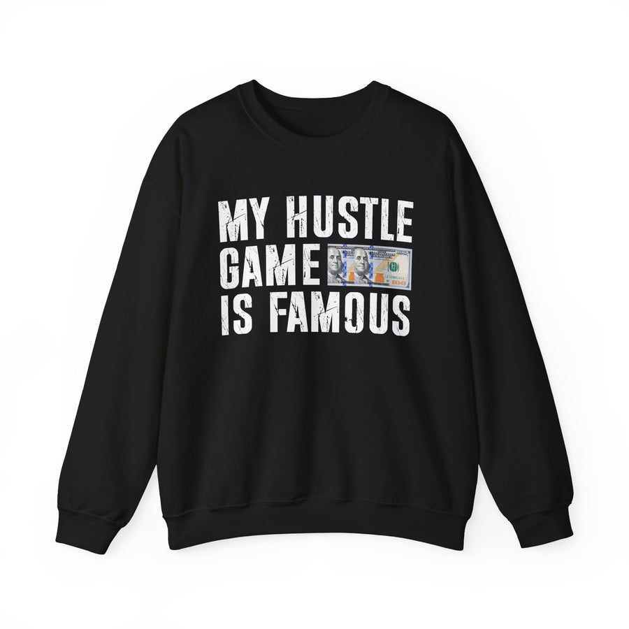 Black sweatshirt with contrasting bold statement lettering reading MY HUSTLE GAME IS FAMOUS, front flat-lay view.