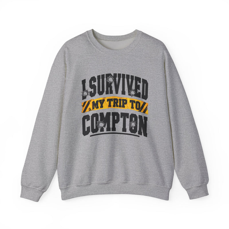 Sweatshirt with collegiate lettering reading I SURVIVED MY TRIP TO COMPTON, front view.