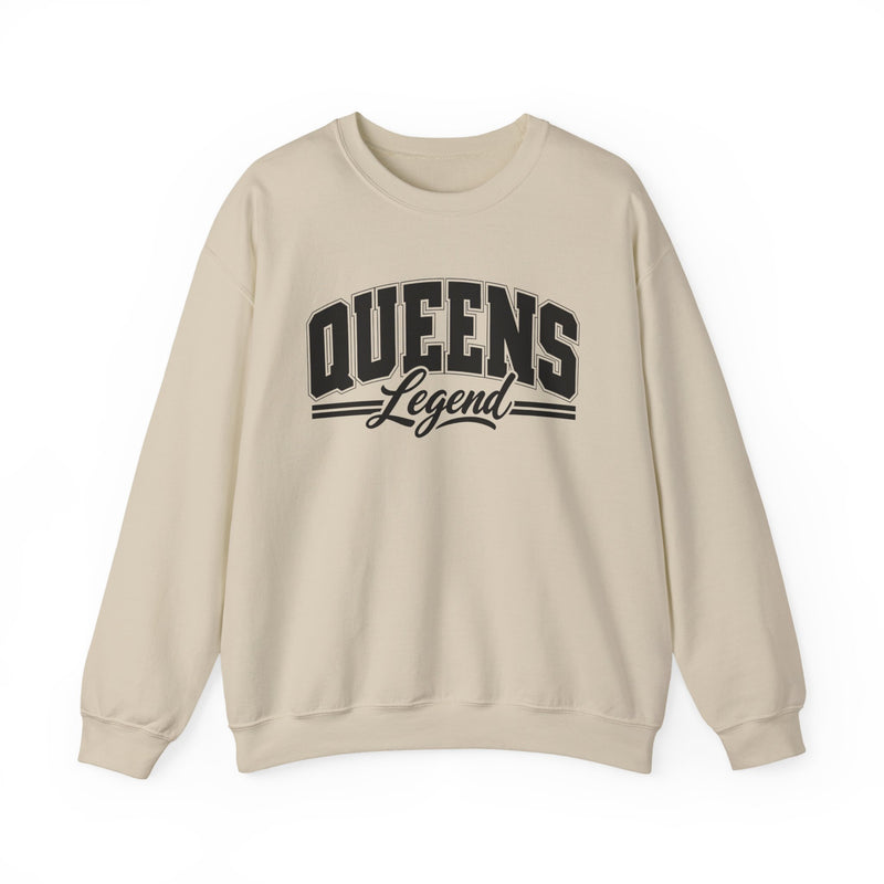 Sand sweatshirt with black varsity block and script lettering reading QUEENS LEGEND, front flat-lay view.