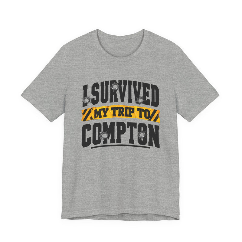 T-Shirt with collegiate lettering reading I SURVIVED MY TRIP TO COMPTON, front view.