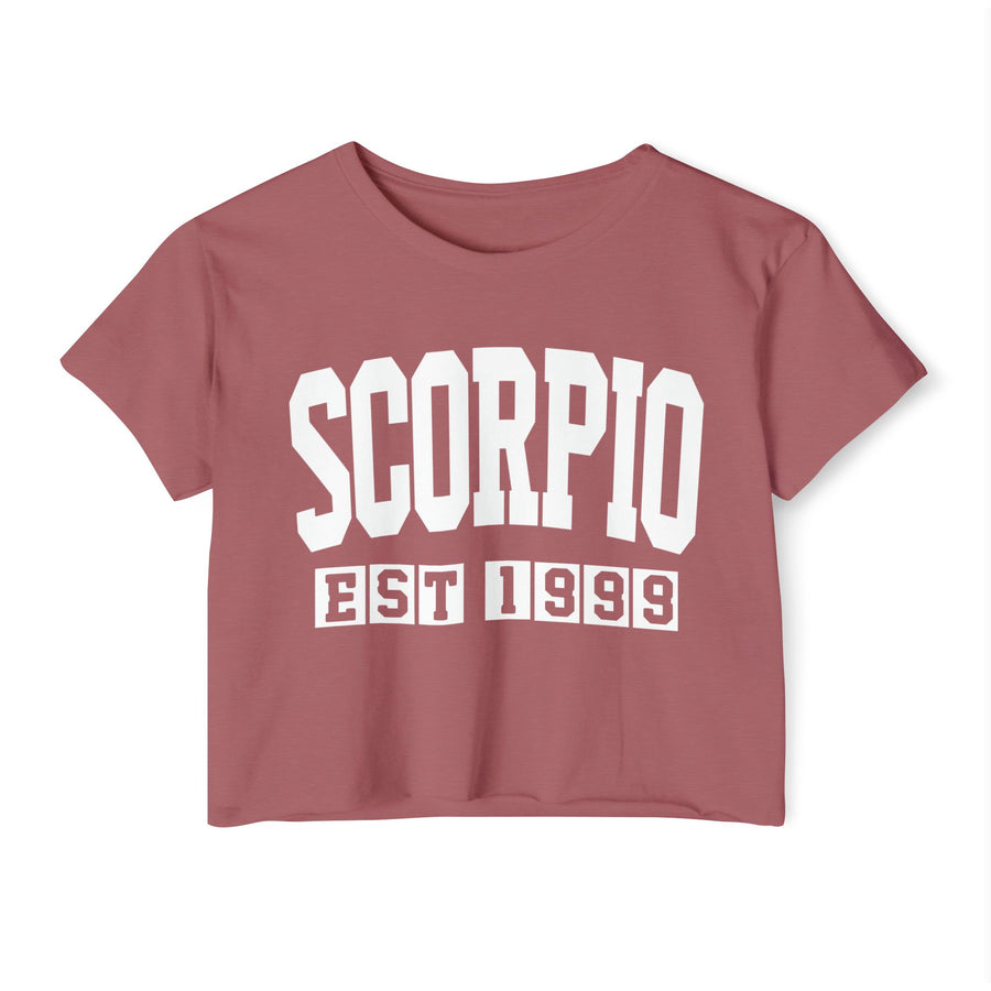 Smoked paprika dusty rose crop top with white arched SCORPIO lettering and boxed EST 1999 print, front view.