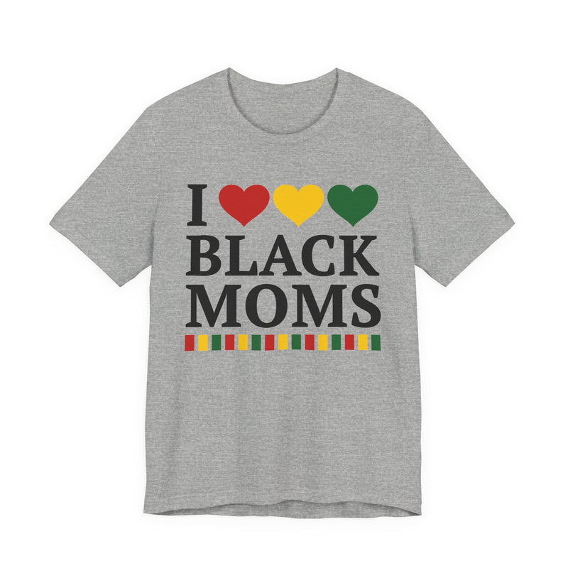 Front flat-lay of the I Love Black Moms t-shirt in Athletic Heather: black 'I' with red, gold, and green hearts above black 'BLACK MOMS' collegiate lettering, with a red, gold, and green stripe bar beneath the text.