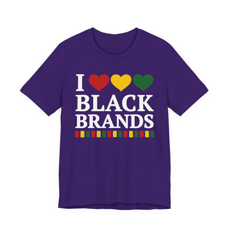 Front flat-lay of the I Love Black Brands t-shirt in Team Purple: white 'I' with red, gold, and green hearts above white 'BLACK BRANDS' collegiate lettering, with a red, gold, and green stripe bar beneath the text.