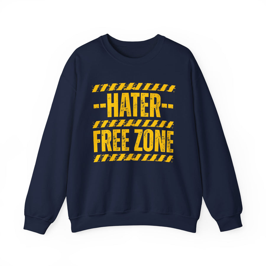 Navy sweatshirt with red and yellow caution-tape lettering reading "HATER FREE ZONE", front flat-lay view.