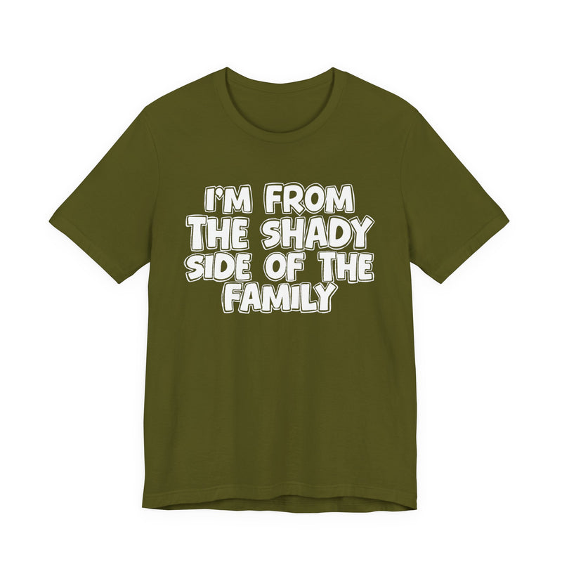 dark t-shirt with ‘I’M FROM THE SHADY SIDE OF THE FAMILY’ statement text in bold outline lettering, front flat-lay view.