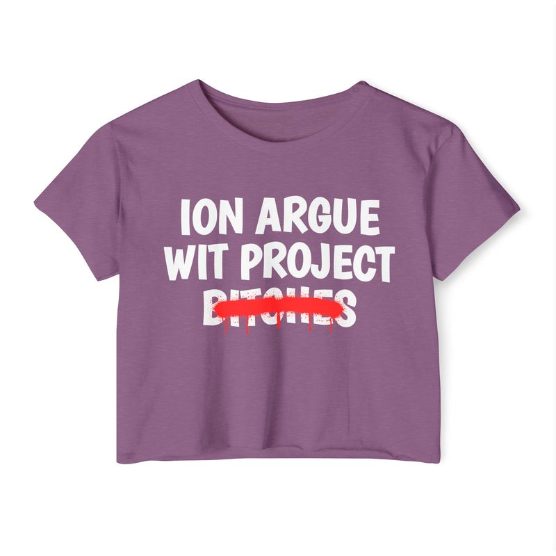 Shiraz crop top with white stacked uppercase "ION ARGUE WIT PROJECT BITCHES" lettering, "BITCHES" crossed by a red spray-paint strike with drips, front flat-lay view.