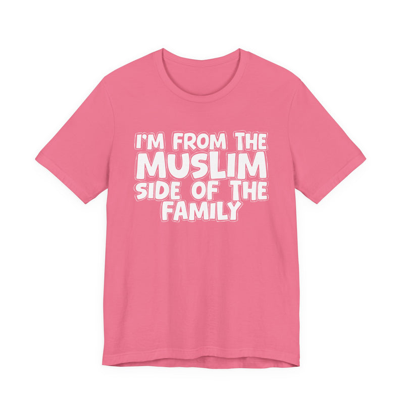 Charity Pink t-shirt, printed with the "I'M FROM THE MUSLIM SIDE OF THE FAMILY" statement in bold outlined bubble lettering, front flat-lay view.