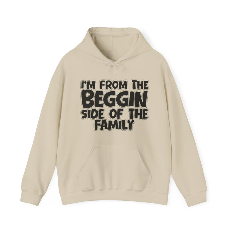 Sand hoodie with "I'M FROM THE BEGGIN SIDE OF THE FAMILY" in bold black outlined bubble lettering, front flat-lay view