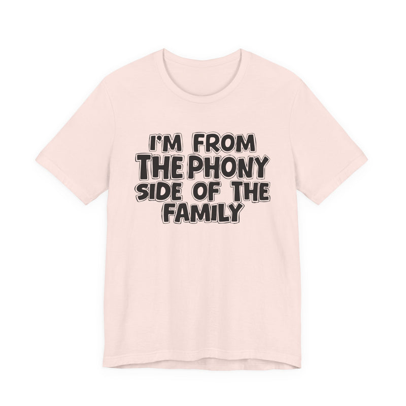 Soft Pink t-shirt with white outlined bubble lettering reading 'I'M FROM THE THE SASSY SIDE OF THE FAMILY', front flat-lay view.