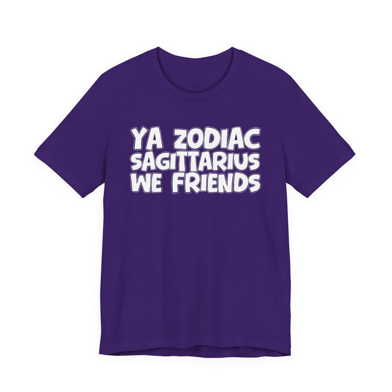 Team Purple t-shirt with white 'YA ZODIAC SAGITTARIUS WE FRIENDS' cartoon bubble lettering, front flat-lay view.