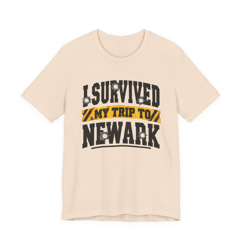 T-Shirt with collegiate lettering reading I SURVIVED MY TRIP TO NEWARK, front view.