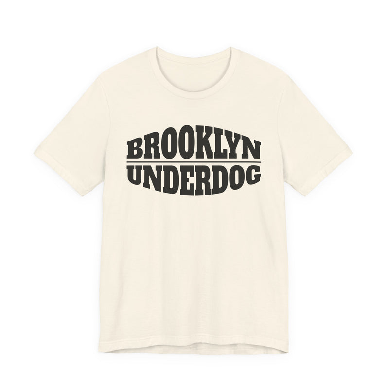 Soft Cream T-shirt with black arched BROOKLYN and inverted-arch UNDERDOG collegiate print, front flat-lay view